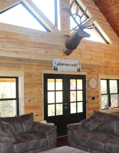 game room, great room, wood burning fireplace, cabin rental, log home, vacation rentals in crystal falls mi, iron county mi, iron river michigan